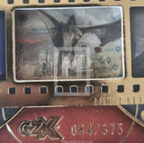 Close-up of a collectible card with a horse image and branding on a textured surface.