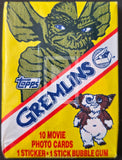 Topps Gremlins trading card pack with character illustration on yellow background