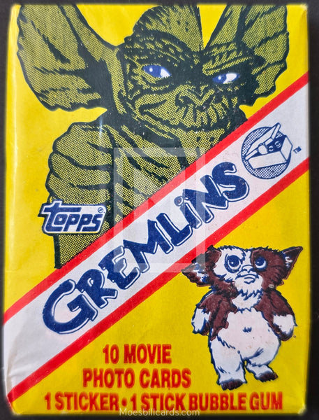Topps Gremlins trading card pack with character illustration on yellow background