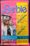 Barbie trading card packaging with a doll image on a pink and yellow background