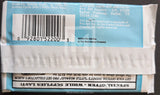 Back of a trading card packaging with a barcode and text