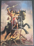 Illustration of a warrior on a horse with a sword, signed by Ed Bunker.