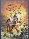 Illustrated card with a warrior and woman on a ship, surrounded by other figures, with a signature at the top.