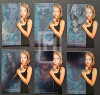 Set of trading cards featuring a character with a sword on a dark background