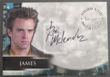 Trading card featuring a person with spiky hair and an autograph, set against a cityscape background.