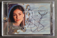 Trading card with a person's face and autograph, encased in clear plastic.