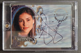 Trading card with a person's face and autograph, encased in clear plastic.