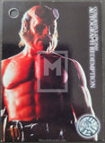 Trading card of a muscular figure with red skin and a helmet, on a dark background.