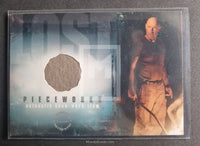 2006 Inkworks Lost Season 2 Pieceworks Trading Card PW-1 Pants Terry O_Quinn as John Locke Front