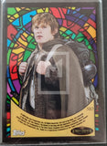 Trading card with a character from 'The Lord of the Rings' series, featuring a stained glass border.