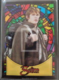 Trading card with a character holding a sword, framed like a stained glass window.