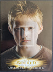 Trading card featuring a young boy with blonde hair and a brown shirt, labeled 'The Seeker: Unlikely Warrior'.