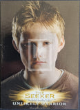 Trading card featuring a young boy with blonde hair and a brown shirt, labeled 'The Seeker: Unlikely Warrior'.
