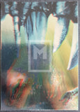 Abstract art with vibrant colors and a logo in the center