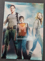 Three characters standing together with a scenic background, featuring 'Moebius Cards' branding.