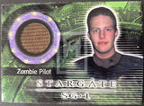 Stargate SG-1 trading card featuring a zombie pilot with a green and black background