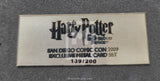 Metallic 'Harry Potter' card set label from San Diego Comic Con 2009 on a gray background