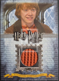 Harry Potter trading card with a character in costume and a close-up of orange fabric.