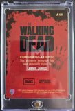 Trading card for 'The Walking Dead' with Lennie James autograph, in clear protective case.