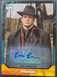 Trading card of a character from 'Doctor Who' with a signature, set against a blurred background.