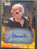 Trading card featuring an alien character from 'Doctor Who' with a signature on it.