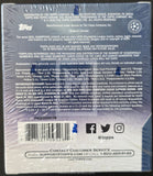 Back of a Topps trading card packaging with branding and contact information.