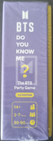 BTS party game box with purple and yellow design