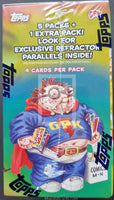 Topps trading card pack with a character holding cards and promotional text.