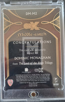 CZX Middle-earth trading card with a signature from Dominic Monaghan, encased in clear plastic.