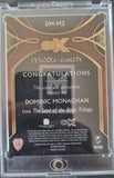 CZX Middle-earth trading card with a signature from Dominic Monaghan, encased in clear plastic.