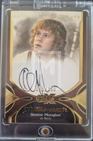 Trading card featuring Dominic Monaghan as Merry from 'The Lord of the Rings' with autograph and branding details.