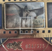 Close-up of a collectible card with a horse image and branding on a textured surface.