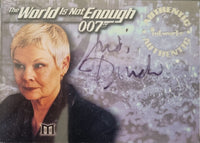 Card featuring a woman with 'The World Is Not Enough' text and '007' branding, signed by Judi Dench.