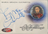 Card featuring Maria Grazia Cucinotta's signature and a James Bond logo, with 'The World Is Not Enough' text.