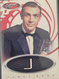 James Bond card featuring a character in a tuxedo with a glass of wine, 007 logo, and 'J' emblem.