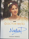 Card featuring a woman with a floral headpiece, 'Doctor Who' branding, and the name Nadia Parkes.