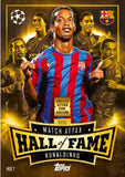 Card featuring Ronaldinho with Barcelona jersey, surrounded by other players, on a dark background with gold accents.