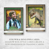 Two illustrated trading cards shown on a light textured background with promotional text below. The left card features a young boy in a shirt and tie with dinosaur-themed artwork and the title 'STR PWR'.