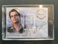 Trading card featuring a person's portrait and signature on a gray background