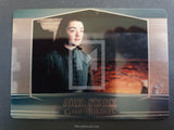 Trading card featuring Arya Stark from 'Game of Thrones' with a scenic background.