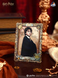 Harry Potter collectible card with decorative border on a table
