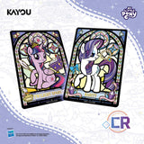 Two stylized My Little Pony trading cards featuring Twilight Sparkle and Rarity in stained-glass art, shown on a pale lavender background with Kayou branding and Hasbro logos.